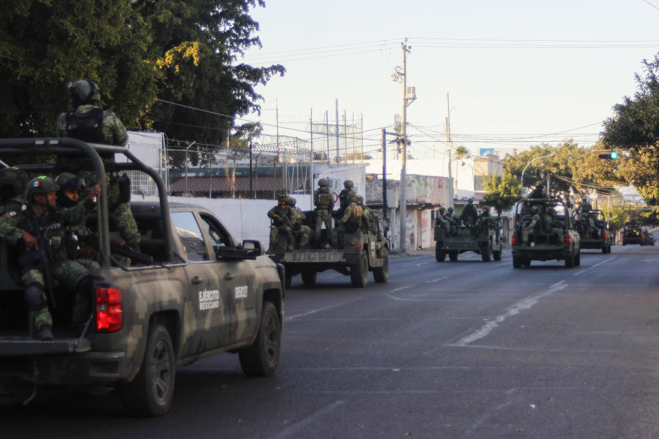 An army convoy patrols the streets of Culiacan, Sinaloa state, Thursday, Jan. 5, 2023. Mexican security forces captured Ovidio Guzmán, an alleged drug trafficker wanted by the United States and one of the sons of former Sinaloa cartel boss Joaquín “El Chapo” Guzmán, in a pre-dawn operation Thursday that set off gunfights and roadblocks across the western state’s capital. (AP Photo/Martin Urista)