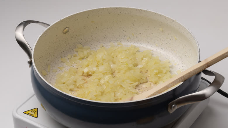 onions sauteing in a pan