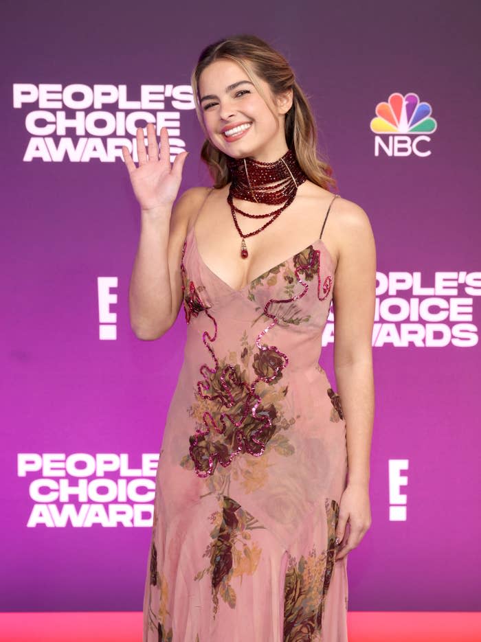 Addison waving to photographers as she walks the red carpet at the People's Choice Awards