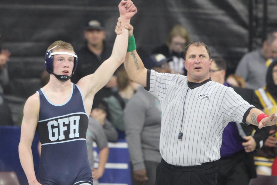 The arm of Great Falls High's Irish Furthmyre is raised in victory as he wins the consolation championship in the 145-pound weight class at the Combined All-Class State Wrestling Tournament at Metra Park in Billings Saturday, Feb. 12, 2022.