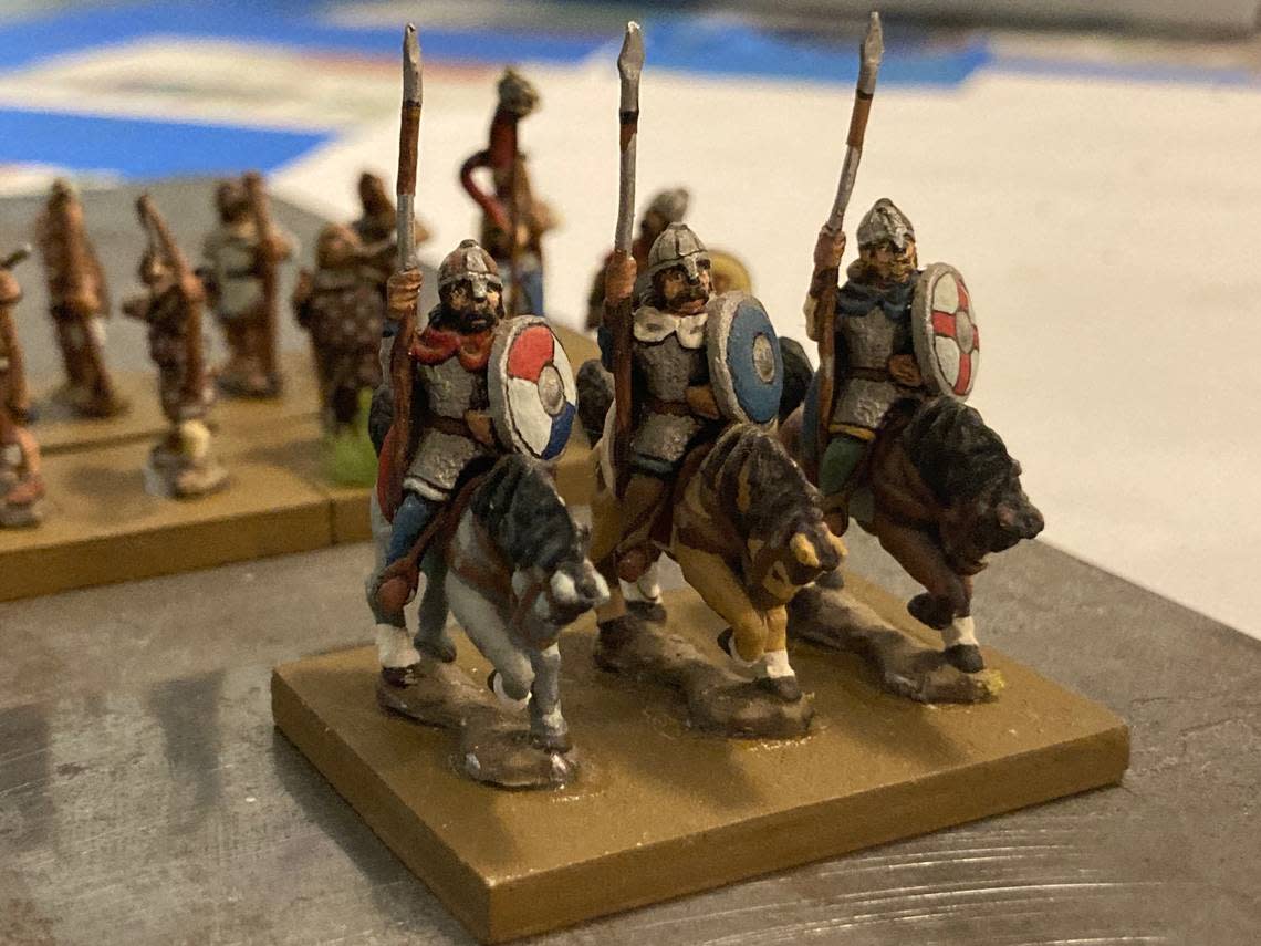 Miniature cavalry supported by archers ready for conflict at Baker University’s popular January war-gaming class.