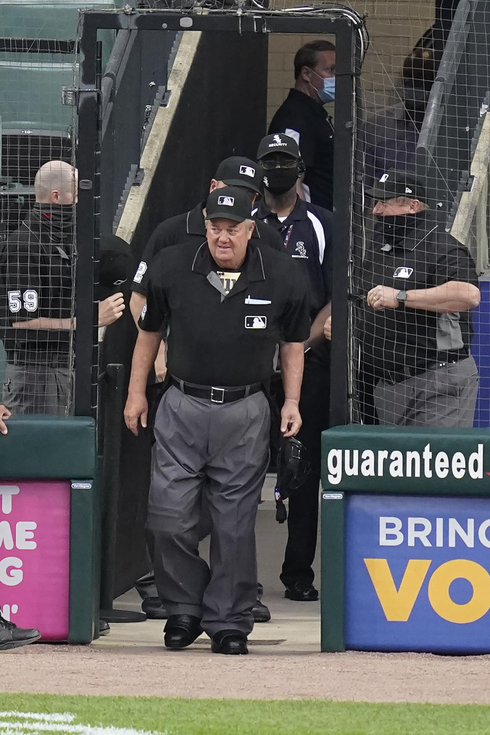 Joe West steps onto the field set to break the record for most games as a major league umpire with No. 5,376, at a baseball game between the St. Louis Cardinals and the Chicago White Sox on Tuesday, May 25, 2021, in Chicago. (AP Photo/Charles Rex Arbogast)