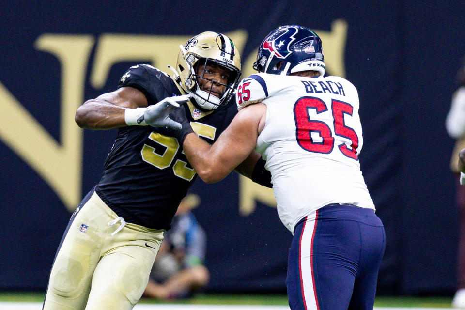 Aug 27, 2023; New Orleans, Louisiana, USA; New Orleans Saints defensive end Isaiah Foskey (55) rushes against Houston Texans guard Tyler Beach (65) during the first half at the Caesars Superdome. Mandatory Credit: Stephen Lew-USA TODAY Sports