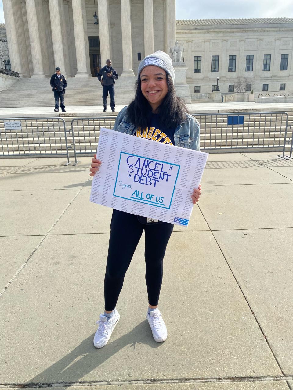 Eliana Reed, 26, stands outside the Supreme Court as justices heard arguments about President Joe Biden's student loan debt forgiveness plan.