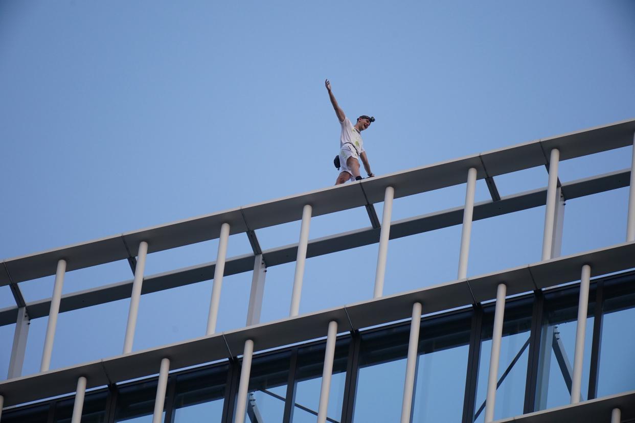 Free-solo climber George King-Thompson walks along the top of the Stratosphere Tower building, a 36-storey residential tower block in Stratford, east London (PA) (PA Wire)
