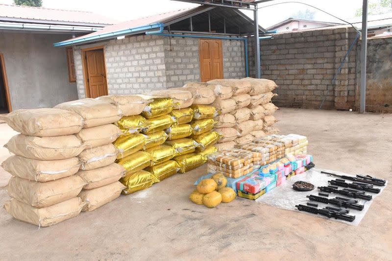 Undated handout photo of weapons, ammunition, alongside bags of crystal methamphetamine and meth-laced yaba pills seized by Myanmar police and military near Loikan village in Shan State