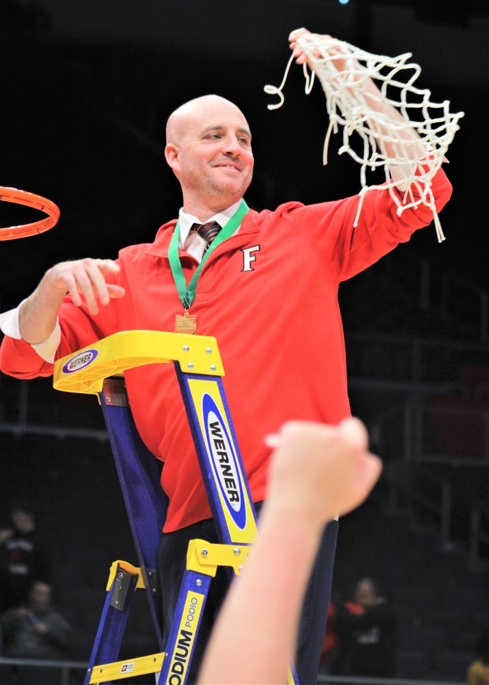 Fairfield head coach D.J. Wyrick with the net during Fairfield's 76-51 win over Huber Heights Wayne in an OHSAA Division I boys basketball district championship game March 4, 2023, at University of Dayton Arena.