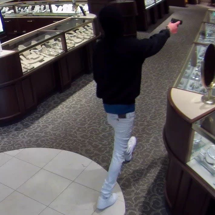 Suspects armed with guns and sledgehammers robbed Fink's Jewelers in Huntersville on July 11.