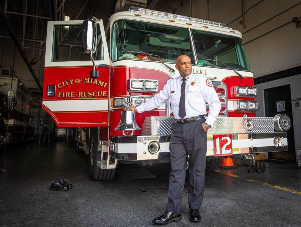Miami Fire Rescue Public Information Officer, Iggy Carroll, poses in front of a fire truck at Miami Fire Station No. 12, 1455 NW 46th St., the first station he worked, Thursday, June 27, 2024, in Miami, Fla. Carroll started working there at 19 and is retiring 35 years later.