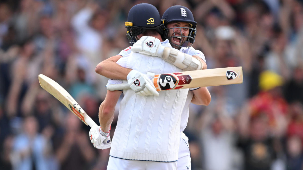  Chris Woakes hugs Mark Wood after hitting the winning runs in the Ashes 