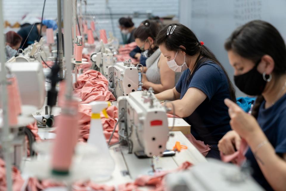 Chemicals involved in clothing production can be hazardous to health. <a href="https://www.gettyimages.com/detail/photo/women-working-at-a-textile-factory-wearing-a-royalty-free-image/1290533849" rel="nofollow noopener" target="_blank" data-ylk="slk:andresr/E+ via Getty Images;elm:context_link;itc:0;sec:content-canvas" class="link ">andresr/E+ via Getty Images</a>
