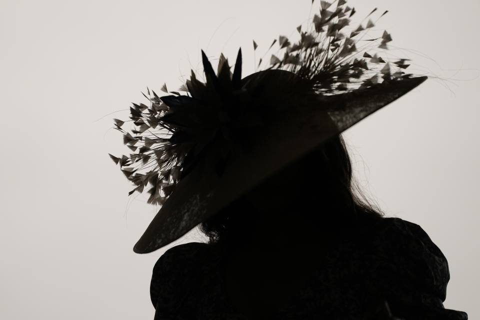 A race fan walks though the stands at Churchill Downs before the 150th running of the Kentucky Derby horse race Saturday, May 4, 2024, in Louisville, Ky. (AP Photo/Charlie Riedel)