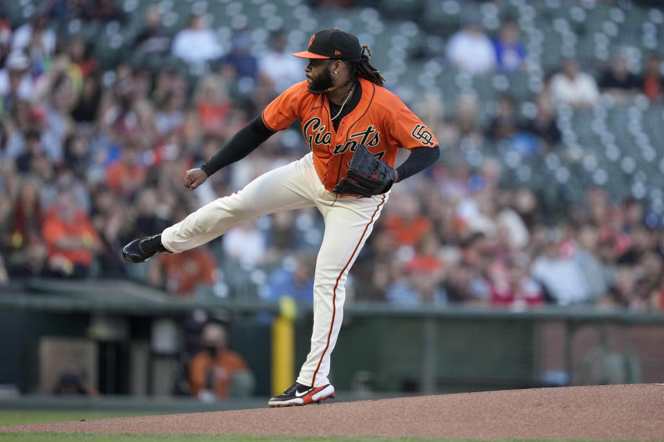 San Francisco Giants starting pitcher Johnny Cueto watches a throw to a San Francisco Giants batter during the first inning of a baseball game Friday, June 18, 2021, in San Francisco. (AP Photo/Tony Avelar)
