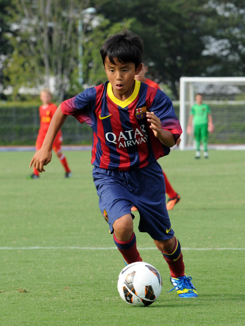 Takefusa Kubo en un torneo Sub-12 con la camiseta del Barcelona. (Foto: Etsuo Hara/Getty Images)