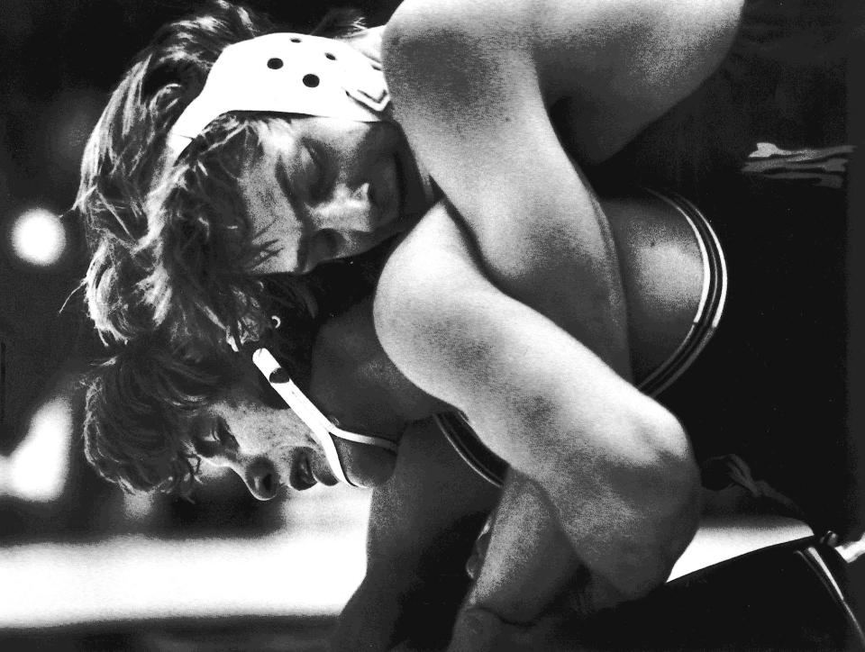 Scott Morningstar of Lisbon, top, became the third wrestler to win a fourth state title in 1980. In this 1979 photo from the state tournament, he is competing against Don Bosco of Gilbertville's Ed Fischels. Morningstar finished with a high school record of 115-1-1.