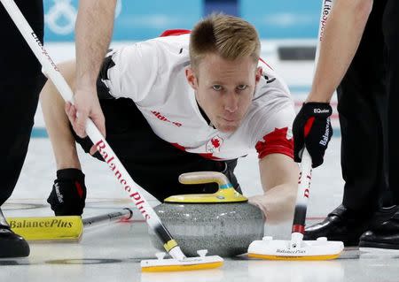 Curling - Pyeongchang 2018 Winter Olympics - Men's Bronze Medal Match - Switzerland v Canada - Gangneung Curling Center - Gangneung, South Korea - February 23, 2018 - Vice-skip Marc Kennedy of Canada delivers the stone. REUTERS/John Sibley