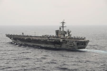 The aircraft carrier USS Theodore Roosevelt (CVN 71) transits the South China Sea in this U.S. Navy picture taken October 29, 2015. REUTERS/U.S. Navy/Mass Communications Specialist 3rd Class Anthony N. Hilkowski/Handout via Reuters
