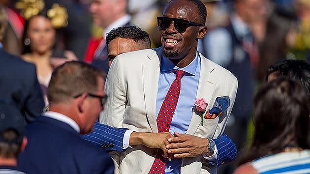 Bolt smiling again and joking with Aussie sprinter John Steffensen seconds after he was nearly booted. Pic: Getty