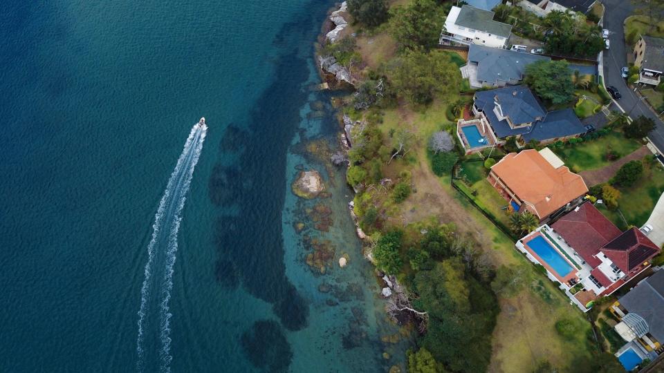 Aerial View of Luxury Waterfront Houses by the Ocean