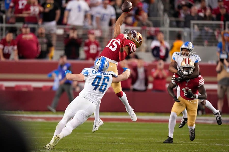 San Francisco 49ers wide receiver Jauan Jennings (15) catches a pass against Detroit Lions linebacker Jack Campbell (46) during the second half of the NFC Championship NFL football game in Santa Clara, Calif., Sunday, Jan. 28, 2024. (AP Photo/Mark J. Terrill)