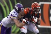 Dec 22, 2013; Cincinnati, OH, USA; Cincinnati Bengals running back Gio Bernard (25) is tackled by Minnesota Vikings defensive end Jared Allen (69) in the third quarter of the game at Paul Brown Stadium. Cincinnati Bengals beat the Minnesota Vikings by the score of 42-14. Mandatory Credit: Trevor Ruszkowksi-USA TODAY Sports