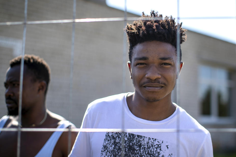 Namgji Richardson Fon, a migrant from Cameroon, poses for photo at the refugee camp in the village of Vydeniai, Lithuania, Saturday, July 10, 2021. European Union member Lithuania has declared a state of emergency due to an influx of migrants from neighboring Belarus in the last few days. Lithuania's interior minister said late Friday that the decision, proposed by the State Border Guard Service, was necessary not because of increased threats to the country of 2.8 million but to put a more robust system in place to handle migrants. (AP Photo/Mindaugas Kulbis)