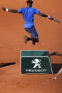 FILE - In this June 1, 2019, file photo, France's Gael Monfils jumps to avoid running into a sponsors board during his third round match of the French Open tennis tournament against France's Antoine Hoang at Roland Garros stadium in Paris. (AP Photo/Christophe Ena, File)