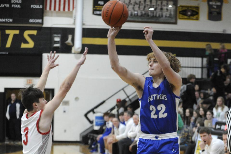 Southeastern's Carter Fisher (#22) shoots a 3-point attempts during the Panthers' preseason scrimmage against the Piketon Redstreaks at Paint Valley High School on Nov. 24, 2023, in Bainbridge, Ohio.