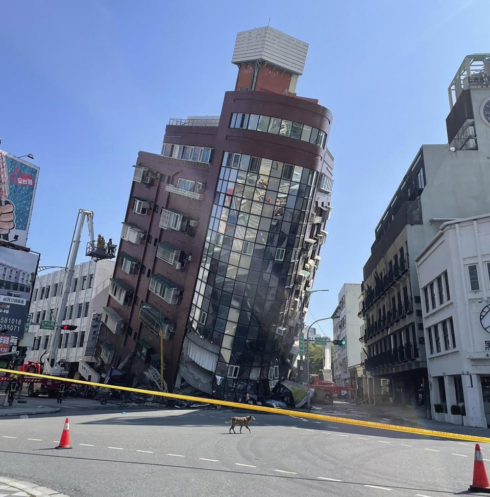 A leaning building is cordoned off in the aftermath of an earthquake in Hualien City.
