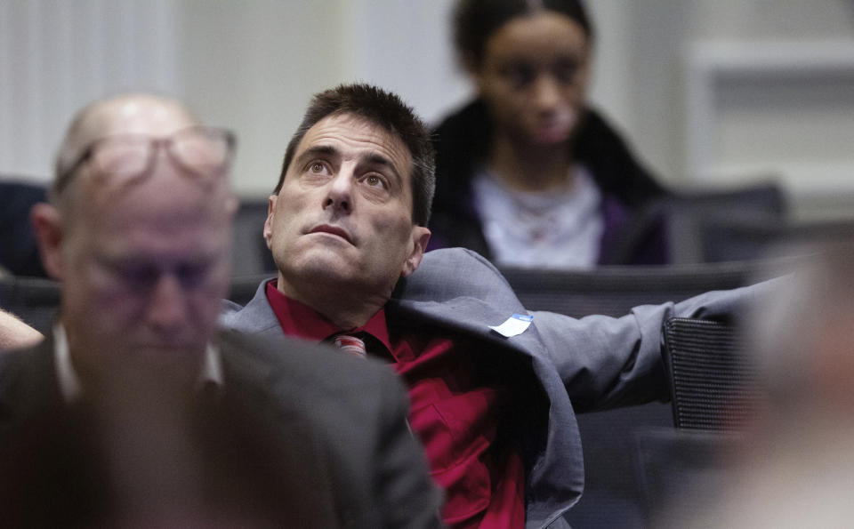 Dallas Woodhouse, executive director of the North Carolina Republican Party, listens to testimony during the third day of a public evidentiary hearing on the 9th Congressional District voting irregularities investigation Wednesday, Feb. 20, 2019, at the North Carolina State Bar in Raleigh, N.C. (Travis Long/The News & Observer via AP, Pool)
