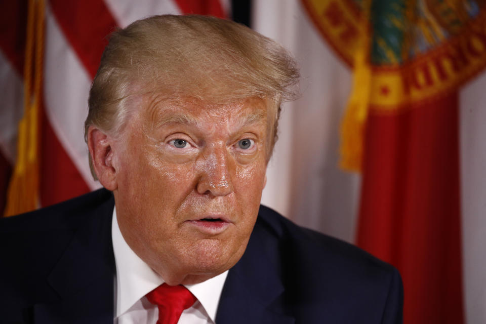 President Donald Trump speaks during a roundtable discussion on the coronavirus outbreak and storm preparedness at Pelican Golf Club in Belleair, Fla., Friday, July 31, 2020. (AP Photo/Patrick Semansky)