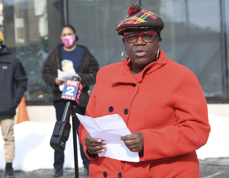 JeDonna Matthews Dinges, the victim of the hate attack, gives her remarks during the rally at St. Ambrose Church, Sunday, Feb. 21, 2021 in Grosse Pointe Park, Mich., following a white resident's display of a Ku Klux Klan flag in a side window facing her home. Dinges said the klan flag was hanging next door in a window directly across from her dining room. The incident occurred two weeks ago. (Clarence Tabb, Jr./Detroit News via AP)