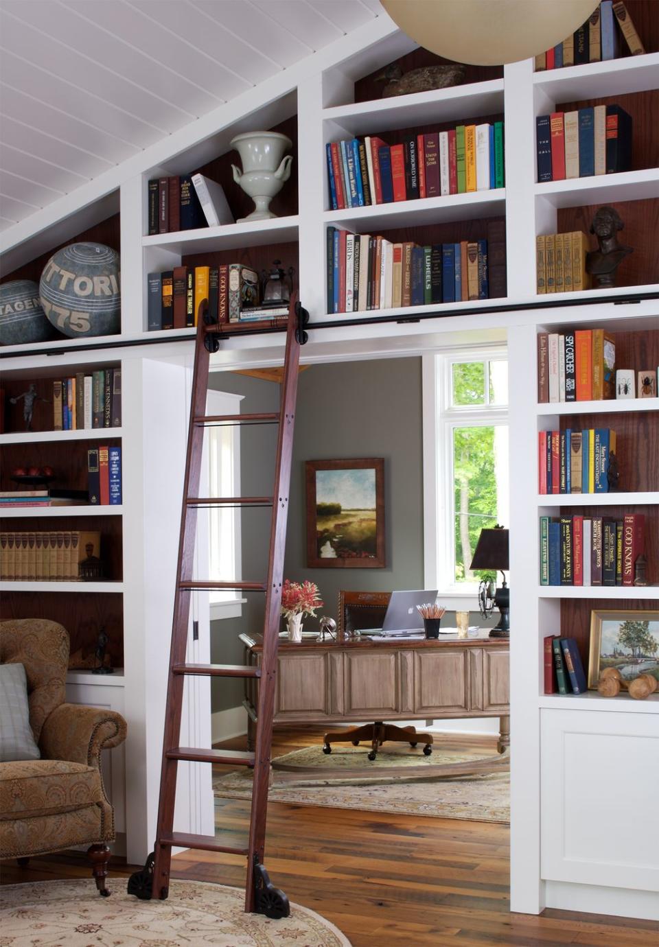 <p>A rolling library ladder removes the stress that comes along with navigating high bookshelves.</p>