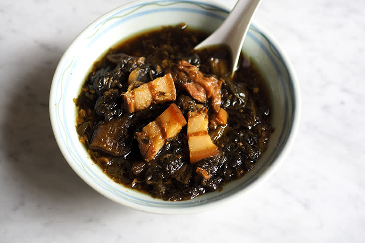 The pork belly cuts are braised with preserved vegetables or 'mui choy'