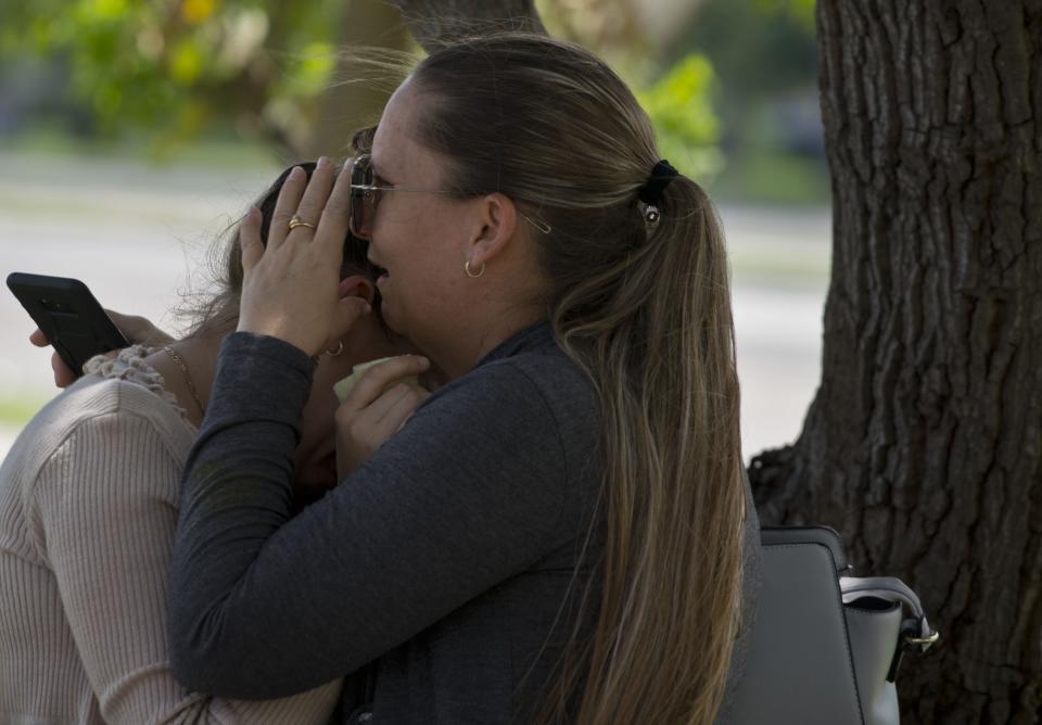 Relatives of passengers who perished in Cuba’s worst aviation disaster grieve outside the morgue in Havana. Source: AP