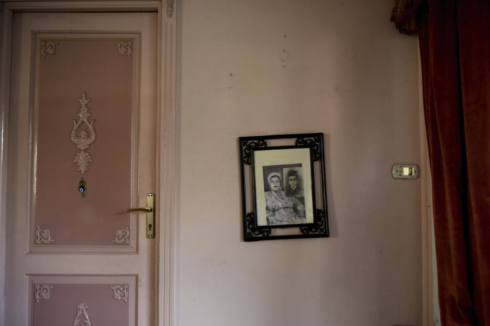 An old family photo hangs in the houseboat belonging to Ikhlas Helmy on June 27, 2022. A government push to remove the string of houseboats from Cairo’s Nile banks has dwindled their numbers from a several dozen to just a handful. Helmy stands to evicted, and the boat moved or demolished. The tradition of living on the Nile River dates back to the 1800s, and the removal of the boats has drawn criticism in Egypt. The government says it plans to develop the waterfront. (AP Photo/Tarek Wagih)