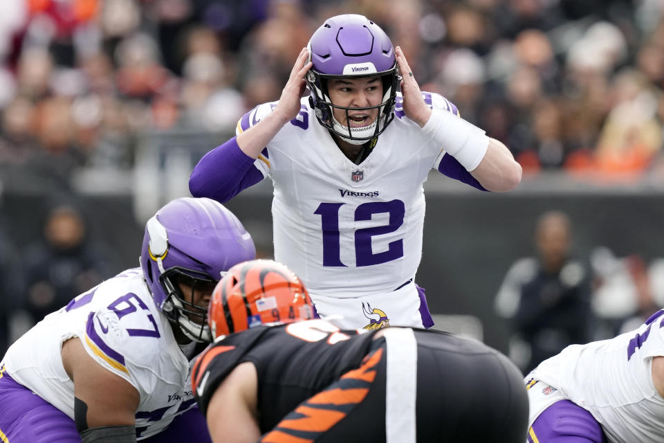 Minnesota Vikings quarterback Nick Mullens (12) calls a play during the first half of an NFL football game against the Cincinnati Bengals, Saturday, Dec. 16, 2023, in Cincinnati. (AP Photo/Carolyn Kaster)