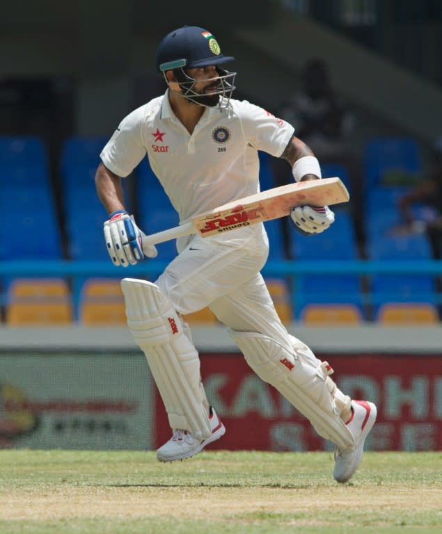 India cricketer Virat Kohli runs during day two of the cricket test match between West Indies and India July 22, 2016 at Sir Vivian Richards Stadium in St John's, Antigua