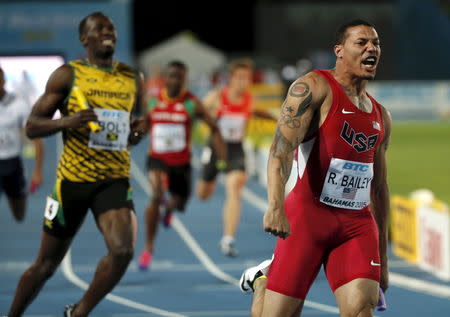 Ryan Bailey of the U.S. (R) celebrates as he crosses the finish line ahead of Jamaica's Usain Bolt (L) as the U.S. win the 4x100 meters race at the IAAF World Relays Championships in Nassau Bahamas, May 2, 2015. Jamaica finished second and Japan third. REUTERS/Mike Segar