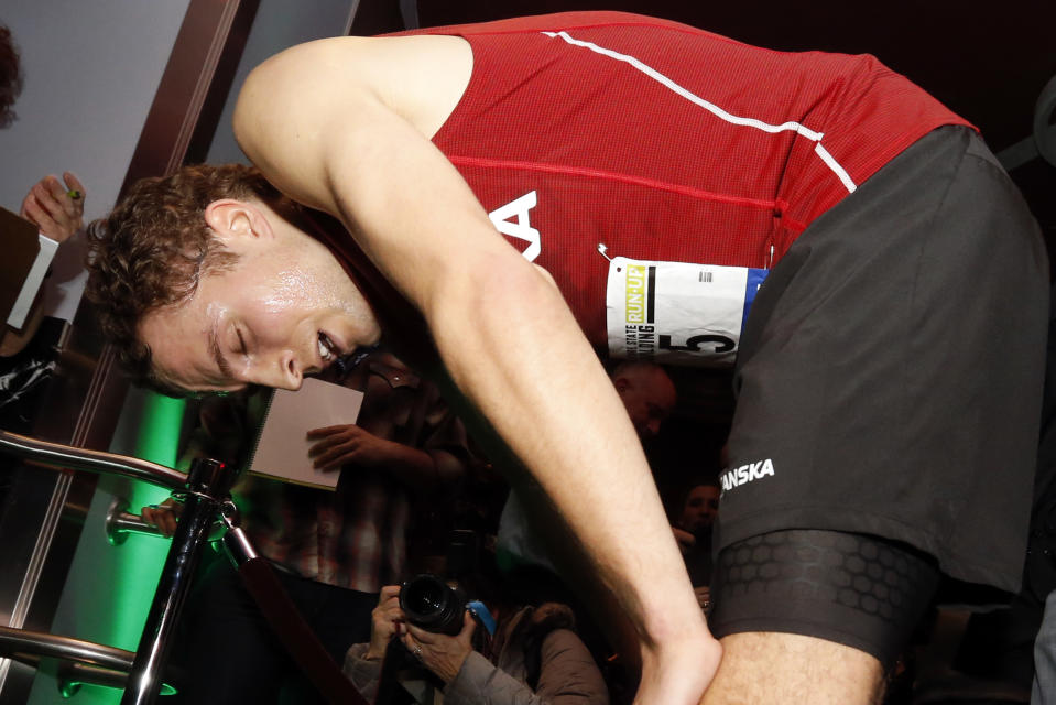 Norway's Thorbjorn Ludvigsen catches his breath after winning the men's division of the Empire State Building Run-Up on Wednesday, Feb. 5, 2014, in New York. (AP Photo/Jason DeCrow)