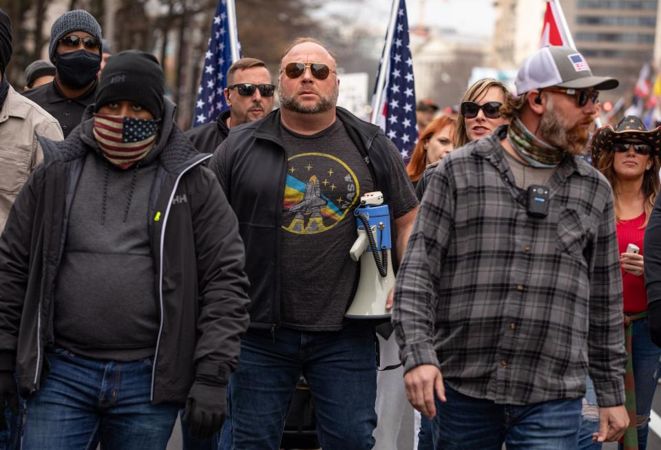 Far-right conspiracy theorist Alex Jones joins supporters of President Donald Trump at a rally in Washington Saturday. (The Washington Post via Getty Images)