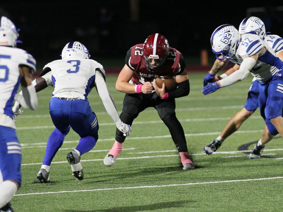 Newark quarterback Steele Meister lowers his shoulders and looks for extra yardage against Central Crossing on Friday.