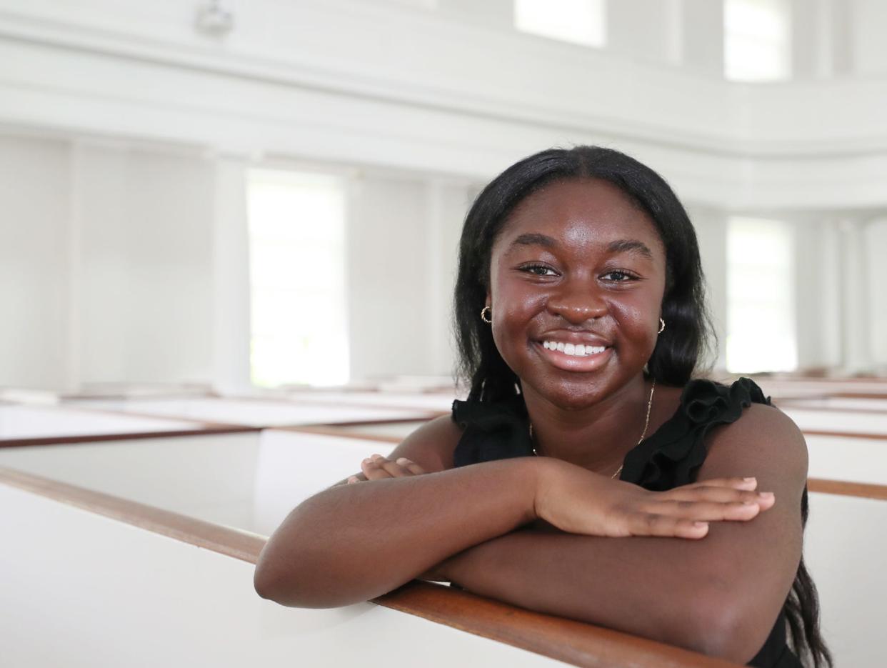 Star student Nana Kyei, 18, a graduate of Western Reserve Academy, poses in the chapel of the school in Hudson. Kyei will major in biology when she attends Yale University beginning this fall.