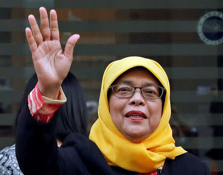 Former speaker of Singapore's parliament, Halimah Yacob, arrives at the Elections Department after she was given the certificate of eligibility to contest the election by the Presidential Elections Committee in Singapore September 11, 2017. REUTERS/Edgar Su