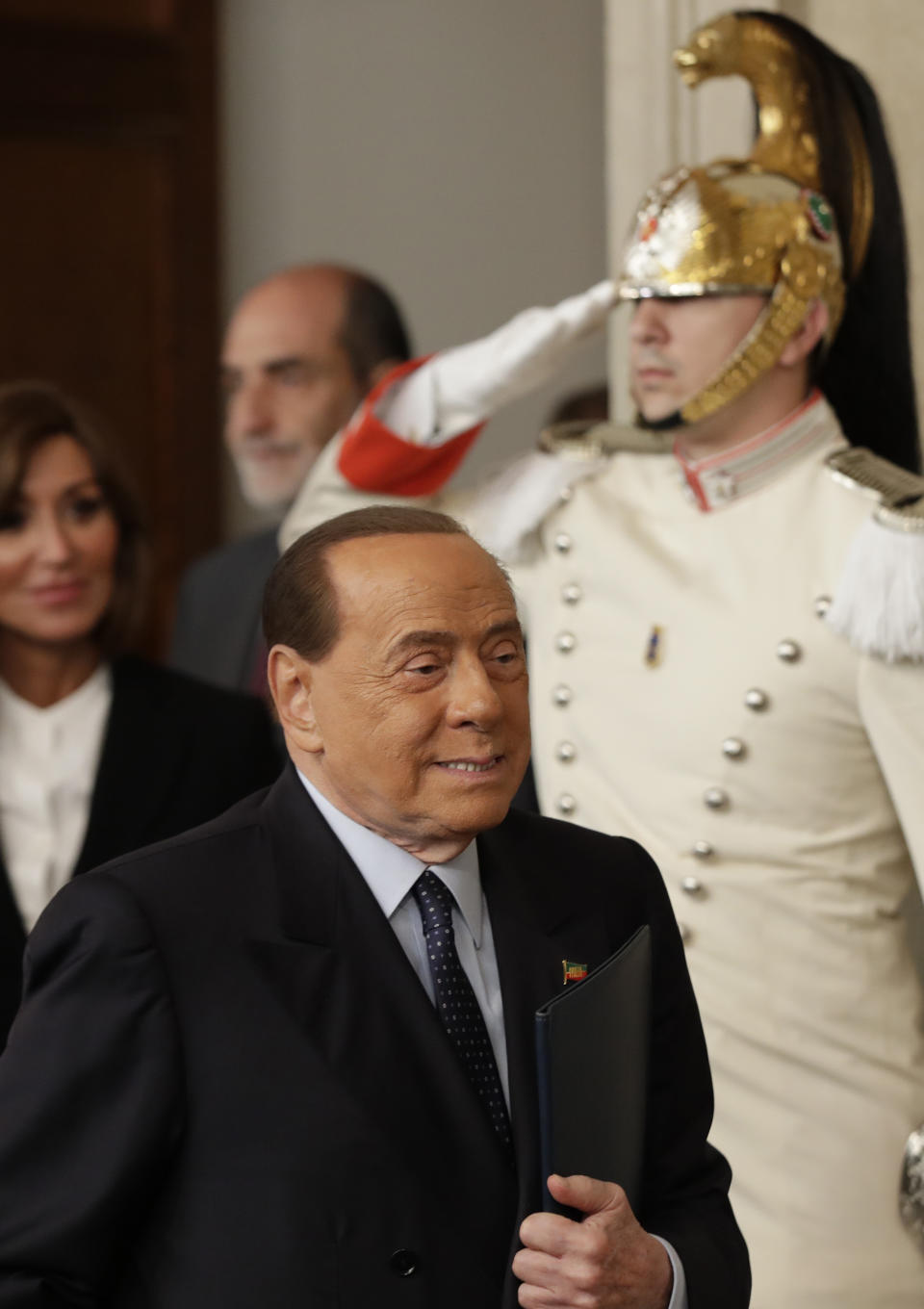 Forza Italia party leader Silvio Berlusconi leaves after meeting Italian President Sergio Mattarella, in Rome, Thursday, Aug. 22, 2019. President Sergio Mattarella continued receiving political leaders Thursday, to explore if a solid majority with staying power exists in Parliament for a new government that could win the required confidence vote. (AP Photo/Alessandra Tarantino)