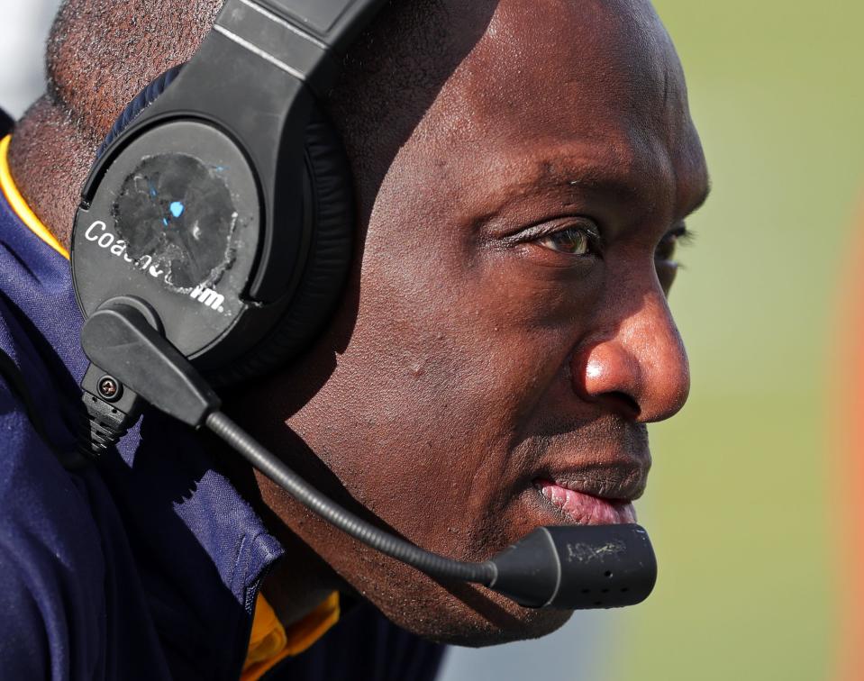 Kent State coach Kenni Burns watches the action on the field Sept. 30 in Kent.