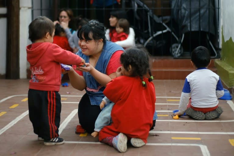 Noelia Garella (C) is the first person with Down syndrome to work as a preschool teacher in Argentina -- and one of the few in the world