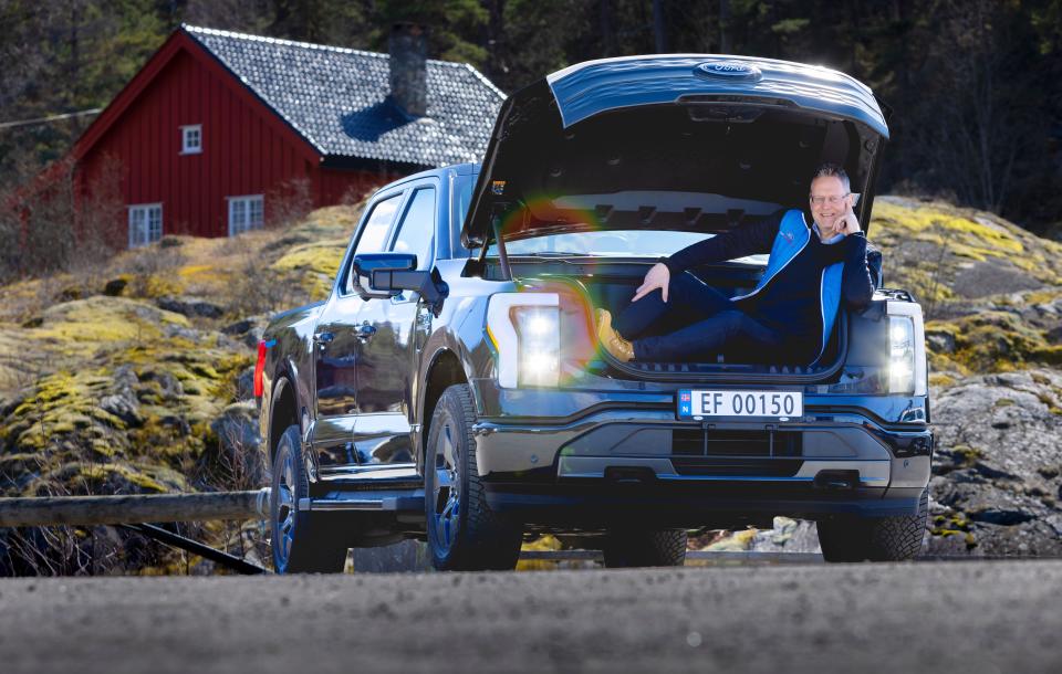 Per Gunnar Berg, managing director of Ford Norway, sits in the front truck of an all-electric Ford F-150 Lightning pickup truck. The vehicle is scheduled to begin shipments to Norway in early 2024.
