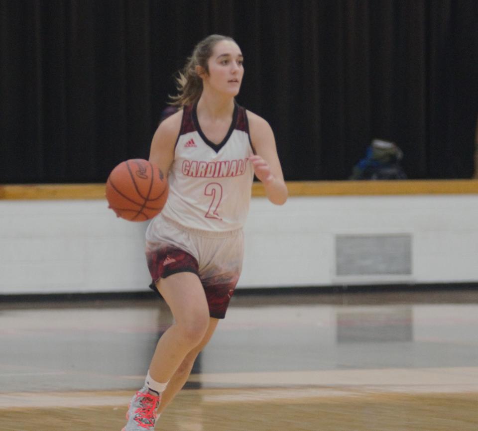 Jocelyn Tobias advances the ball during a girls basketball matchup between Johannesburg-Lewiston and East Jordan on Thursday, December 2.