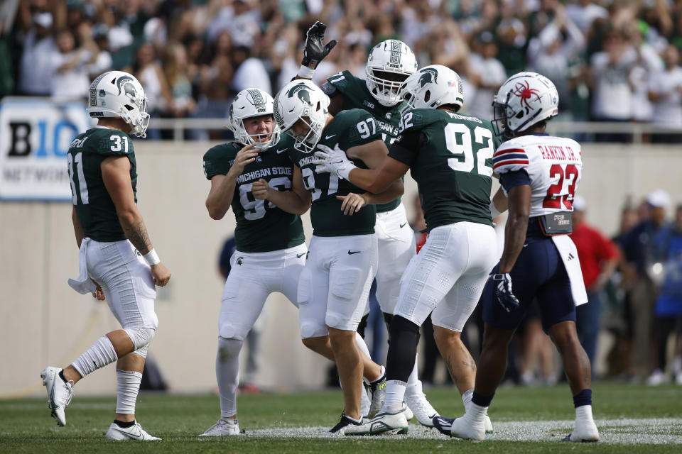 Michigan State players Hank Pepper (31), from left, Ryan Eckley, Jonathan Kim (97), Kristian Phillips, and Evan Morris (92) celebrate Kim's 52-yard field goal against Richmond during the first half of an NCAA college football game on Saturday, Sept. 9, 2023, in East Lansing, Mich. (AP Photo/Al Goldis)